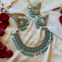 Load image into Gallery viewer, Aarohi Firozi Sky Blue Golden Polki Necklace Set with maangtikka