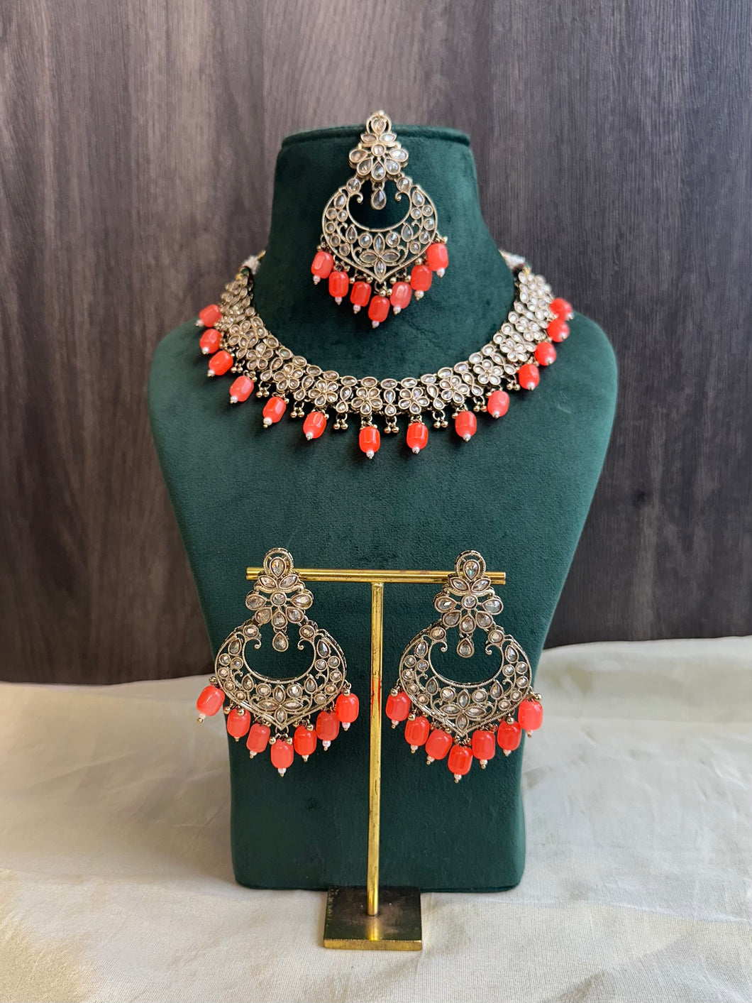 Aarohi Orange Golden Polki Necklace Set with maangtikka