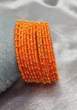 Load image into Gallery viewer, Set of 12 Orange color Golden Beads Bangle set
