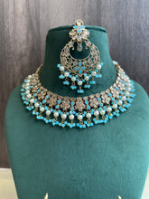 Load image into Gallery viewer, Aarohi Firozi Sky Blue Golden Polki Necklace Set with maangtikka
