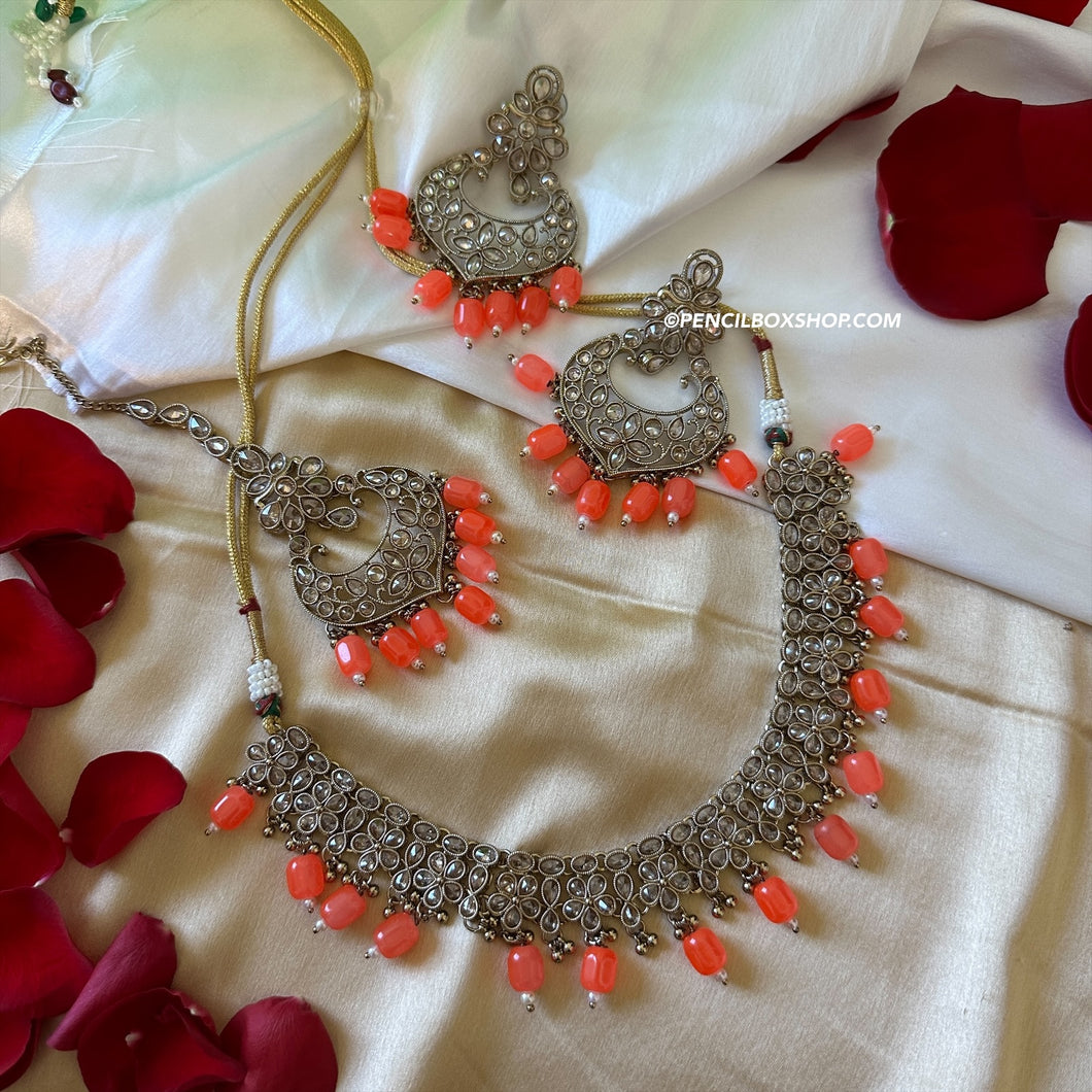Aarohi Orange Golden Polki Necklace Set with maangtikka