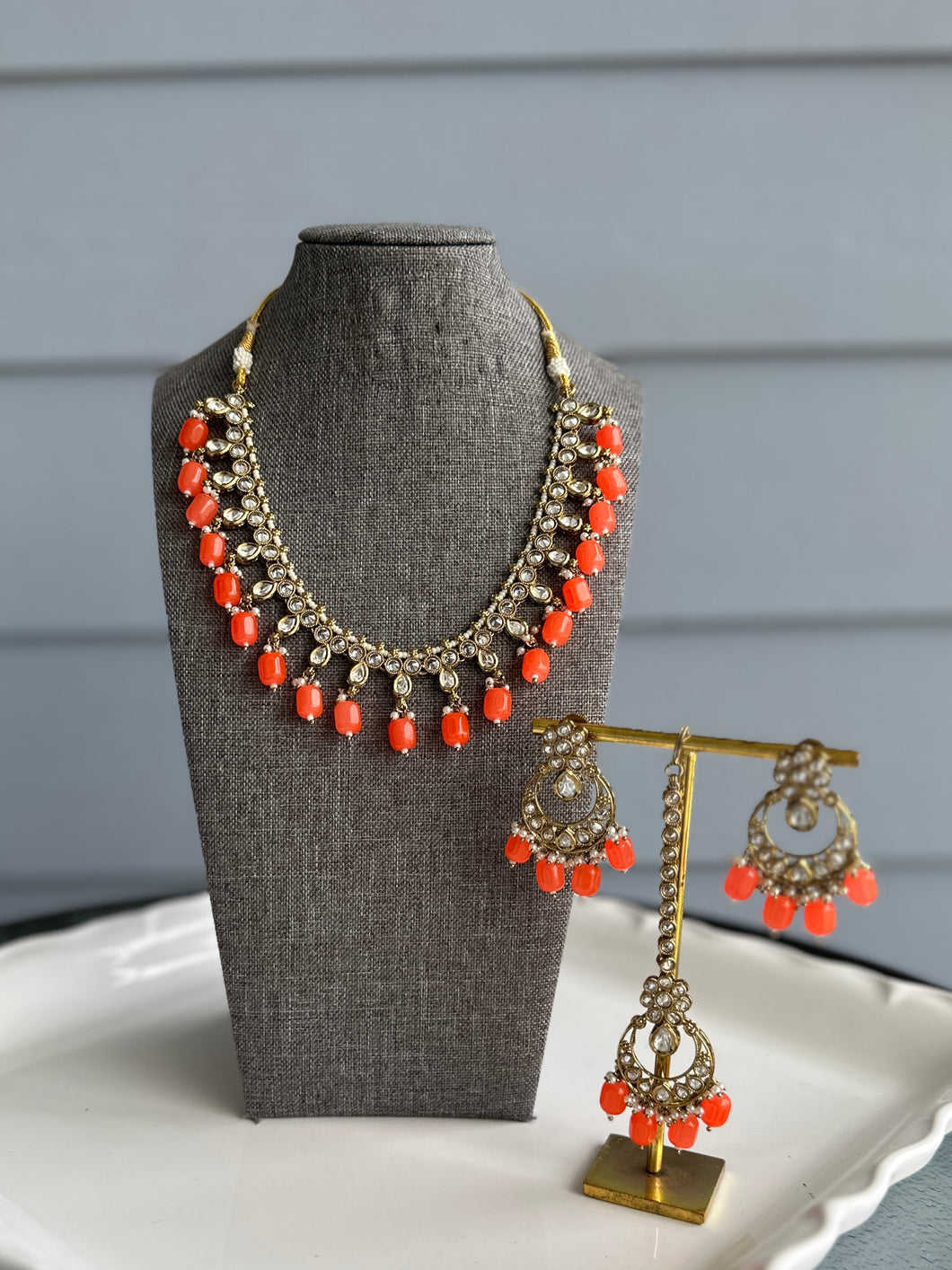 Radhs Orange Golden Kundan Polki Necklace Set with Maangtikka