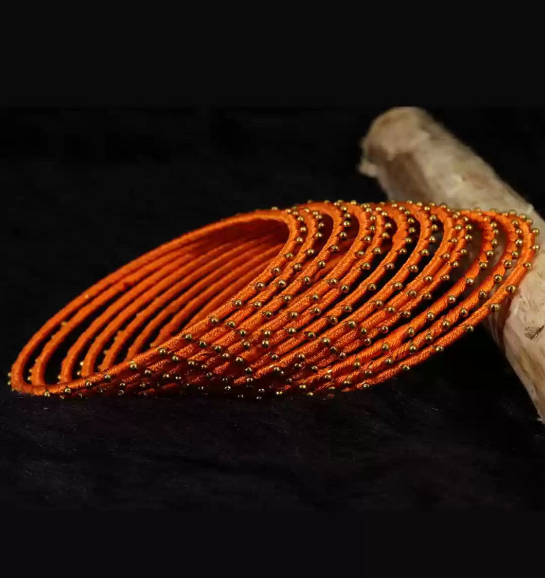 Set of 12 Orange color Golden Beads Bangle set