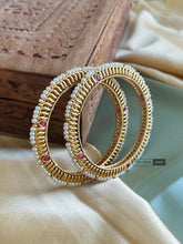 Load image into Gallery viewer, Set of 2 Bangles All pearl Border with Ruby green stone gold finish

