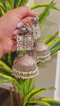 Load and play video in Gallery viewer, 92.5 silver Coated Peacock Three layered Glass Stone pearl Ghunghroo Jhumka Earrings
