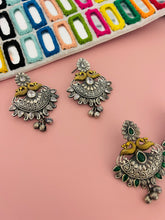 Load image into Gallery viewer, Dual tone German silver Peacock Glass Stone Ghunghroo Earrings
