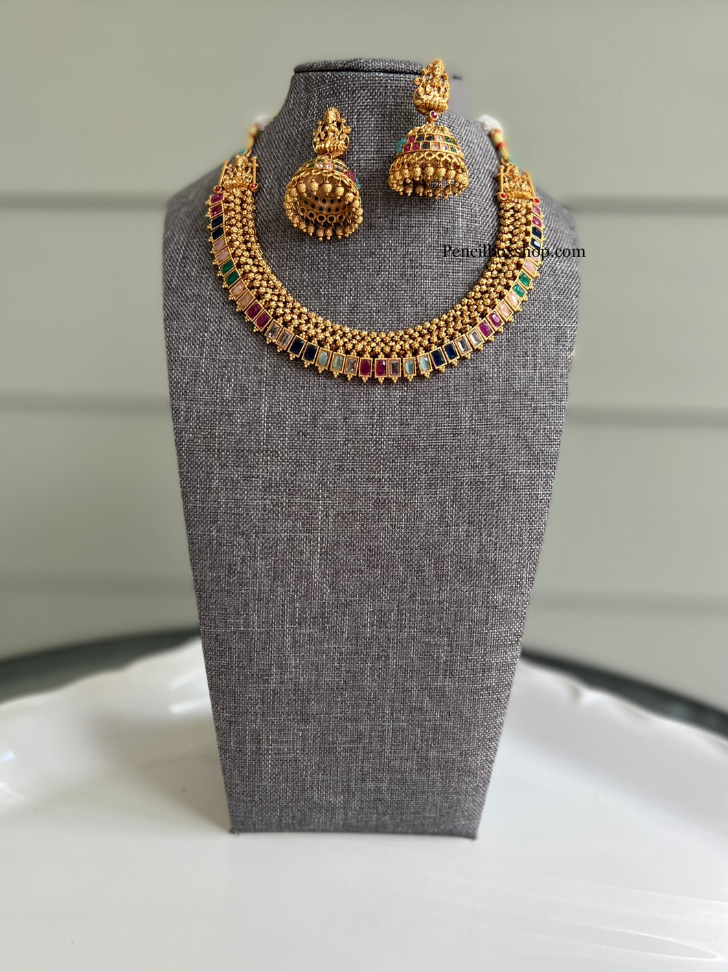 Simple Dainty Multi color Stone Gold finish Necklace set with Lakshmi jhumkas