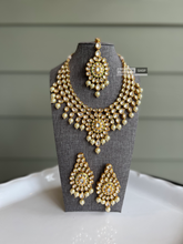 Load image into Gallery viewer, Premium Quality Pearl  Heavy Designer Kundan Necklace set with Back side Meenakari and maangtikka
